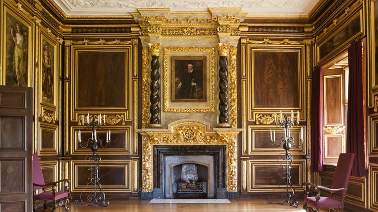 The gilt room at Tredegar House richly decorated with gilded wood